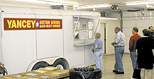 Photo of people registering for auction numbers